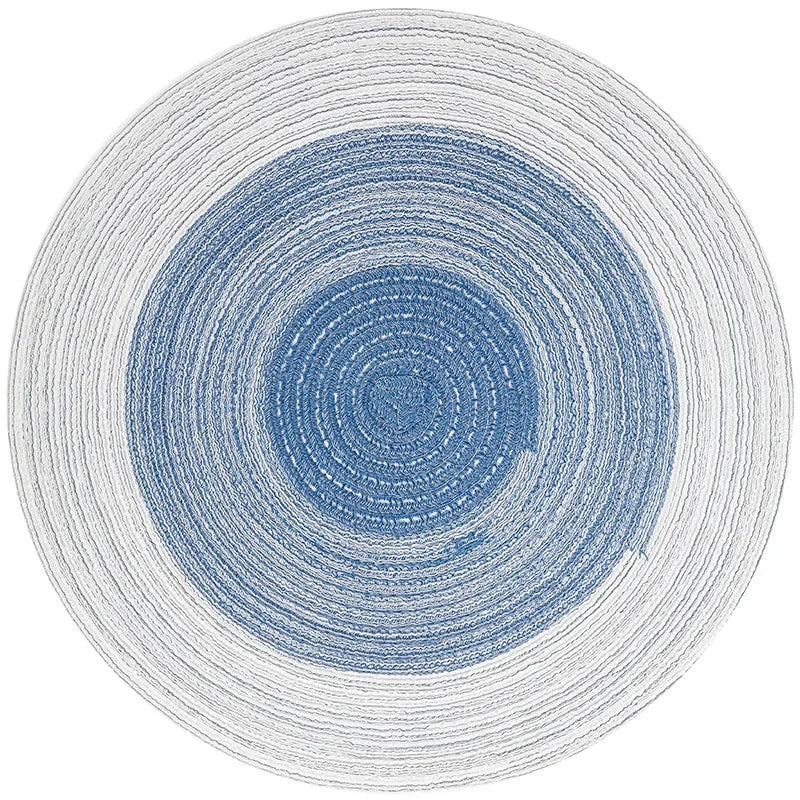 Tapis griffoir circulaire bleu et clair, motif en spirales net et régulier