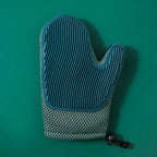 Gant de toilettage double face bleu foncé à picots, forme moufle