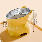 Gamelle pour chat inclinée jaune avec bol inox, base ergonomique et patins anti-déversement.