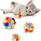 Balle de jeu interactive pour chat, sphère en pompons multicolores.