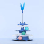 Tourniquet de jouet pour chat bleu clair, plume sur tige et balles pastel