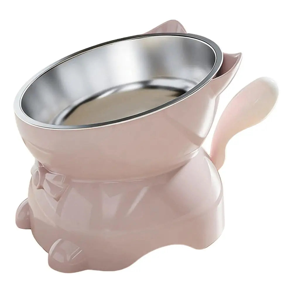 Gamelle pour chat inclinée rose pâle avec bol inox, poignées latérales et base stable.