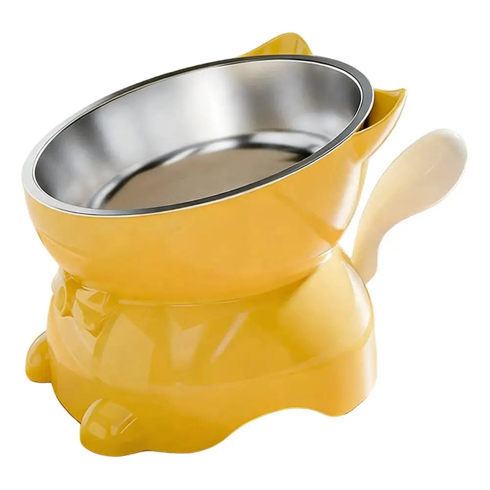 Gamelle pour chat inclinée jaune avec bol inox, poignée latérale et pieds antidérapants.