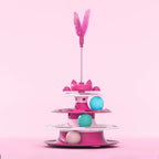 Tourniquet de jouet pour chat fuchsia, plume sur tige et balles bleu/vert