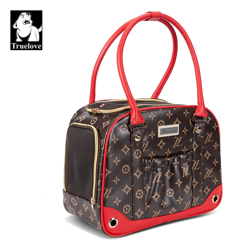 Sac de transport noir et marron avec motif, poignées rouges et poche latérale en maille