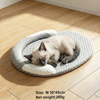 Coussin ovale gris pour chat et chien, avec cale-tête sur le côté